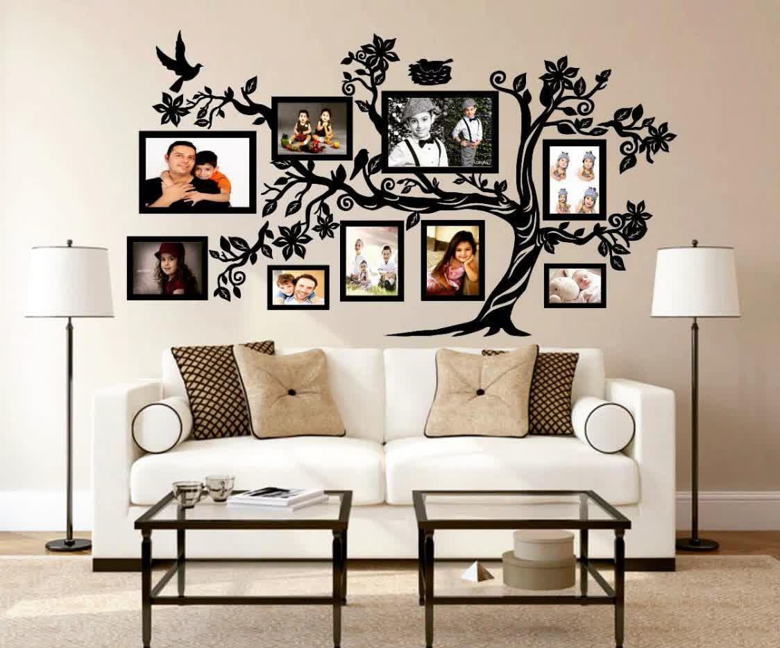 دیزاین اتاق کودک با چیدمان قاب عکس های نوزاد و کودک چیدمان سیسمونی درخت خازرات زیبا